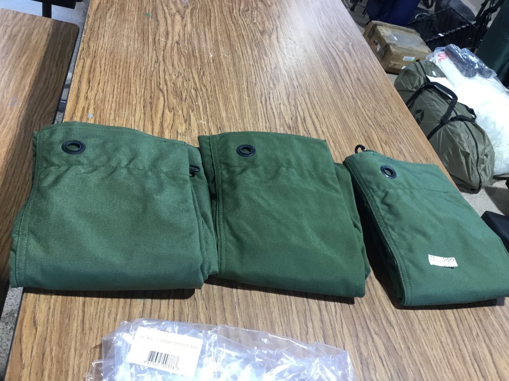 3-Military two strapped duffel bags