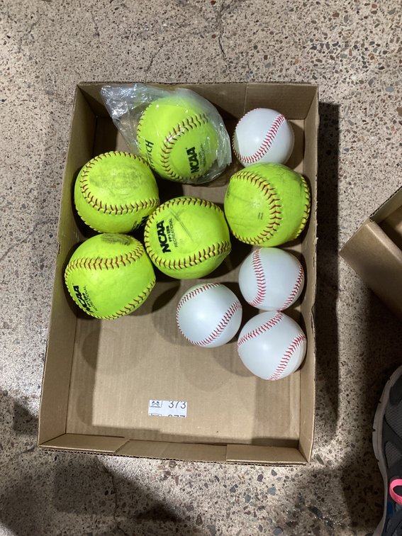 Group of softballs and baseballs