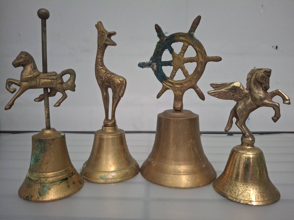 4 Brass Figural Decorative Bells