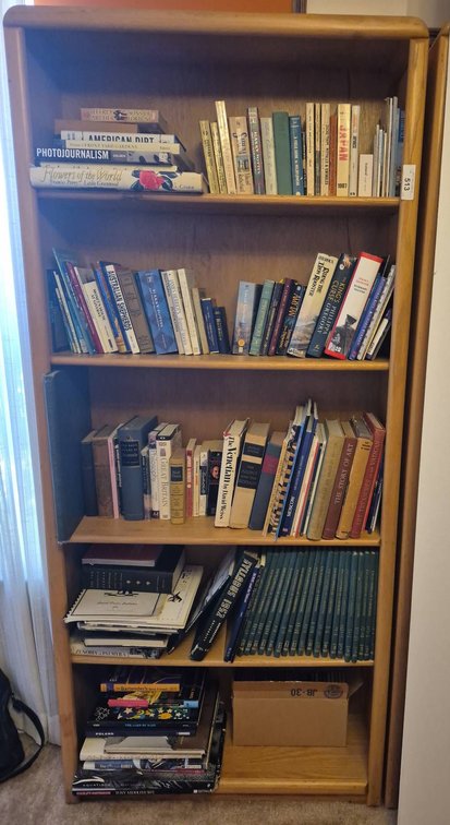 Large Bookshelf With Assorted Books and Box