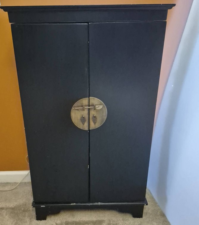 Black Cabinet With CDs, Tapes, And Media