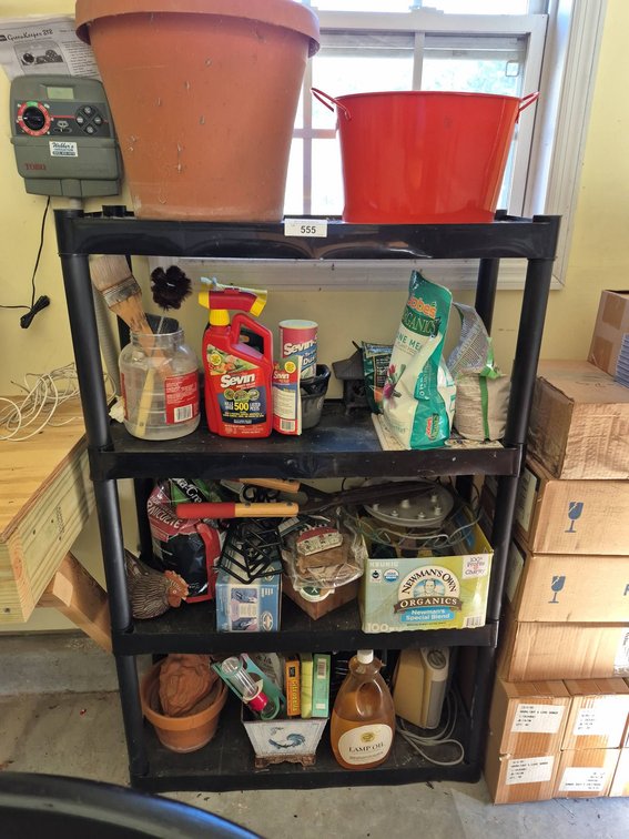 Shelving Unit With Garden Supplies 32x12x50