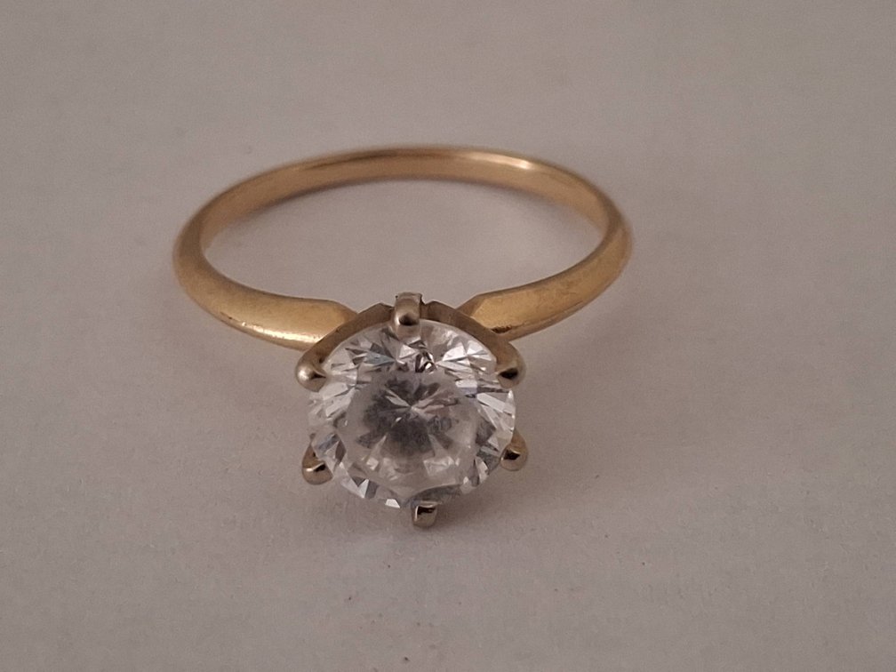 19 - 14K Gold Solitaire Ring With Clear Stone