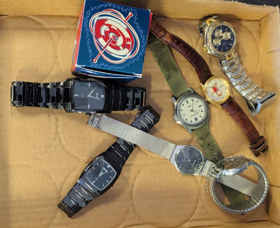6 Wristwatches and Spinning Top