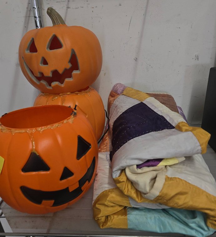 Plastic Pumpkin Decor and Patchwork Quilt