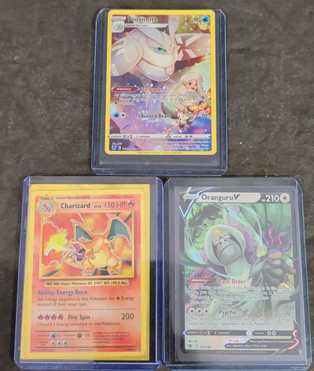 3 Pokémon Cards: Charizard, Oranguru V, Frosmoth