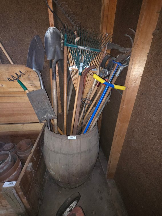 Long Handled Yard Tools in Whiskey Barrel