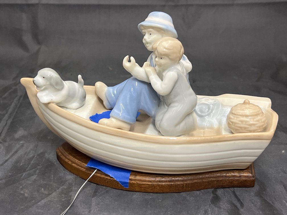 Porcelain Fishing Figurine