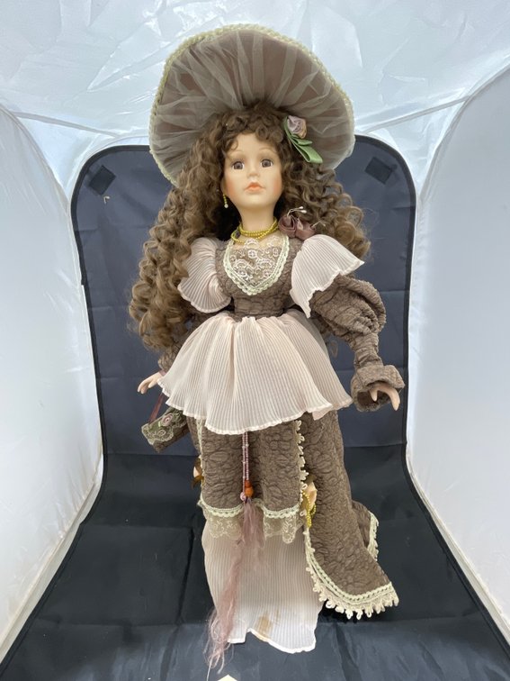Porcelain Doll on Stand
