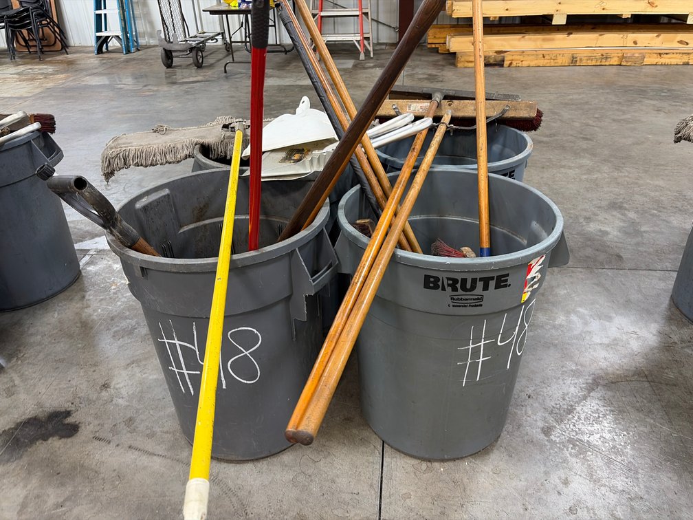 Trash cans and brooms