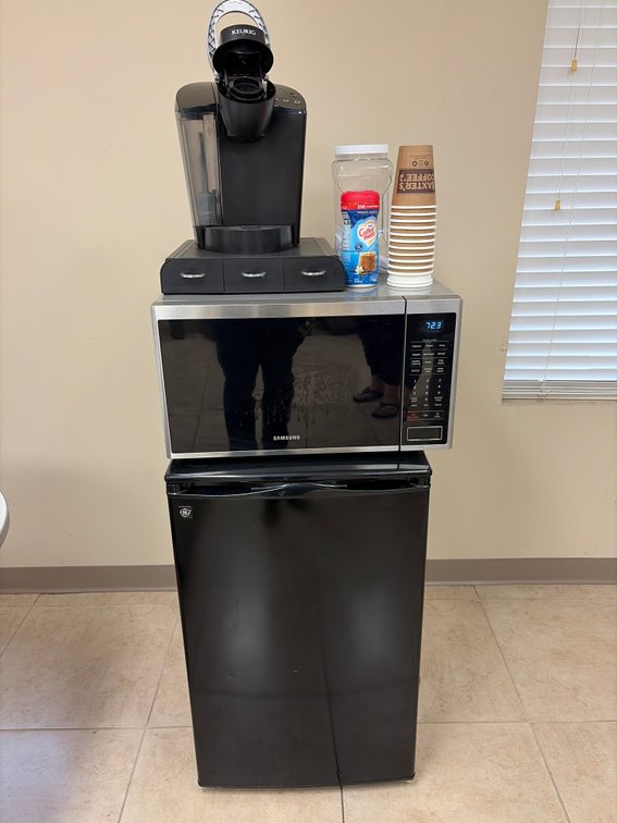Mini fridge, microwave, and coffee pot