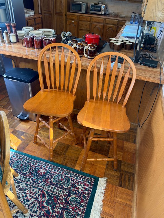 Two matching swivel bar chairs