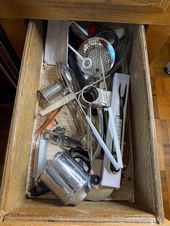 Misc kitchenware in middle drawer