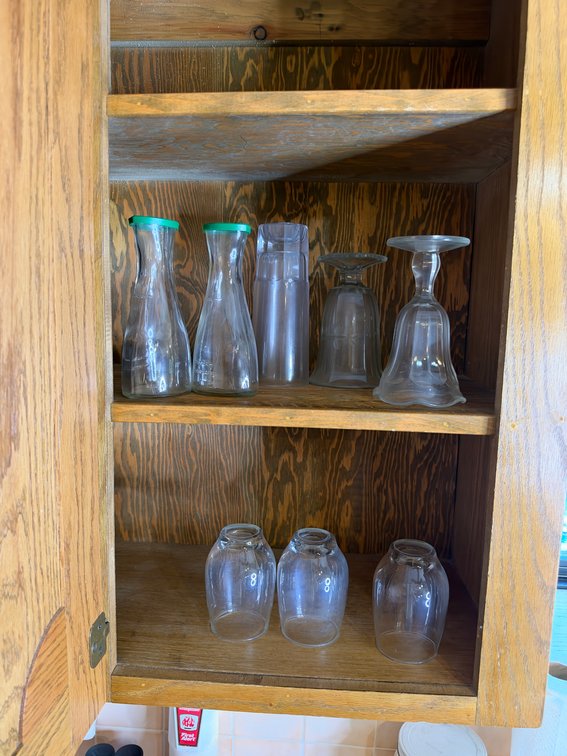 Misc glasses in cabinet