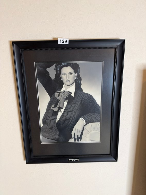 2 black framed portraits