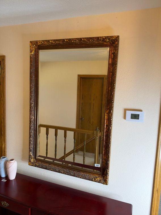 Heavy gold framed mirror