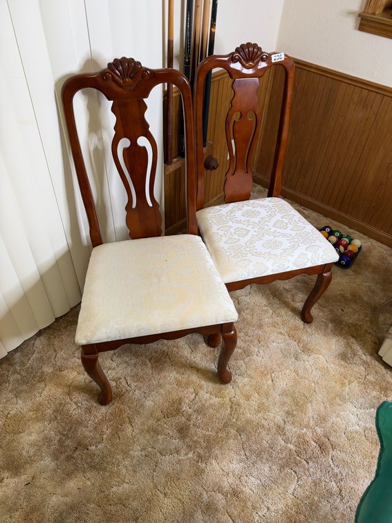 Matching ornate wooden chairs