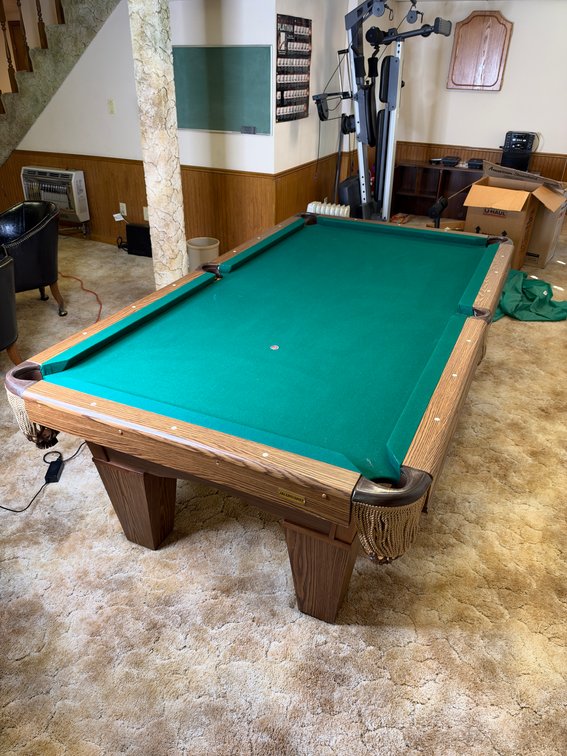 Pool table, sticks, balls, cover