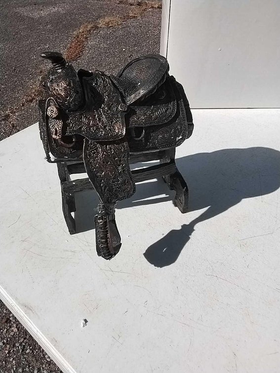 Top Hand Saddle Statue