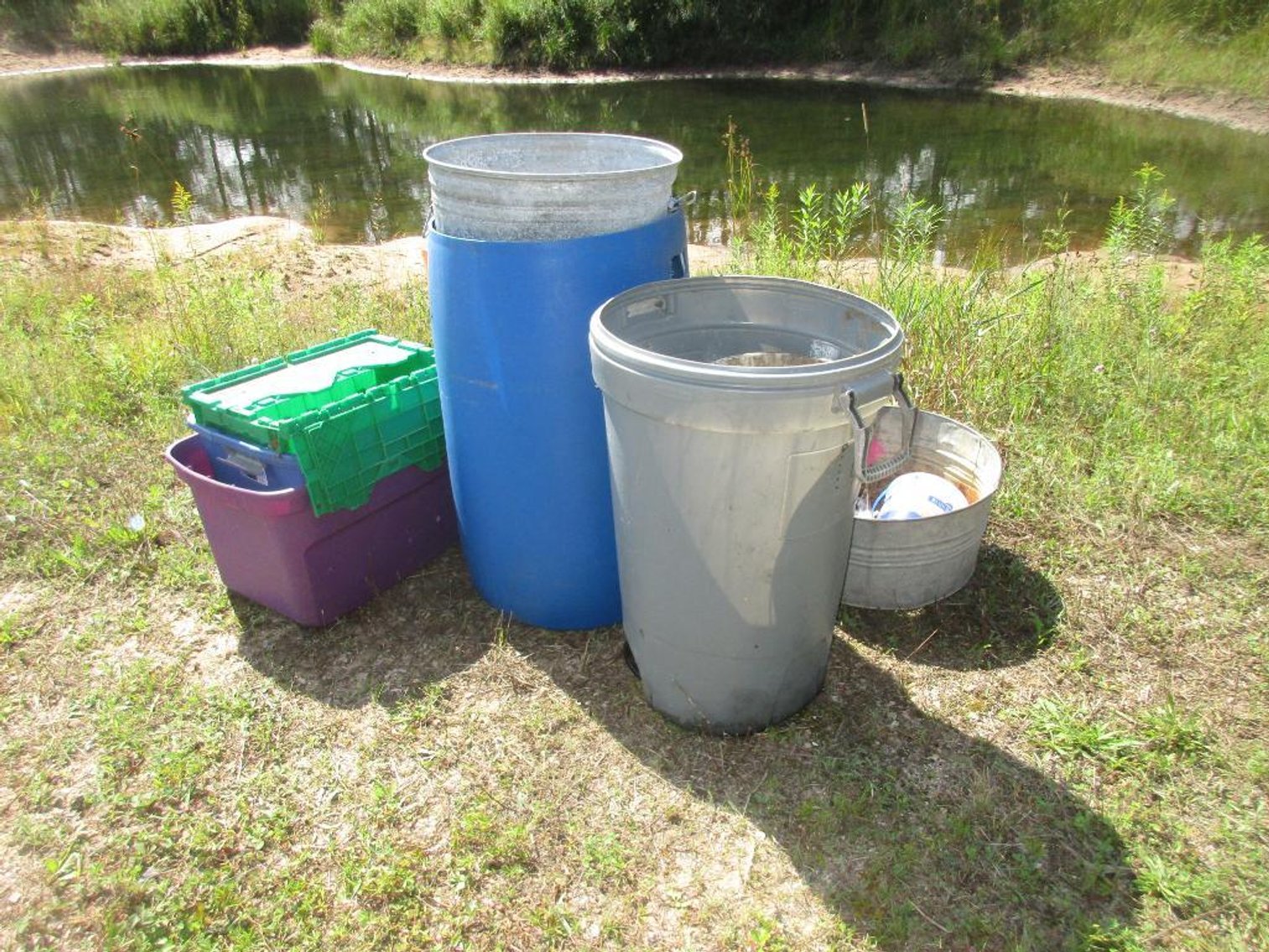 Assortment of Plastic Totes and Barrels