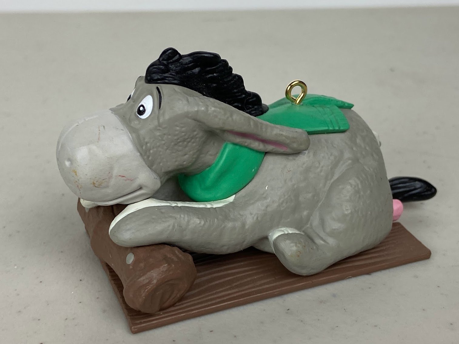 Hallmark Eeyore Keepsake- 1990 Winnie- Pooh-Collection- Eeyore riding on a sled with green scarf- no box