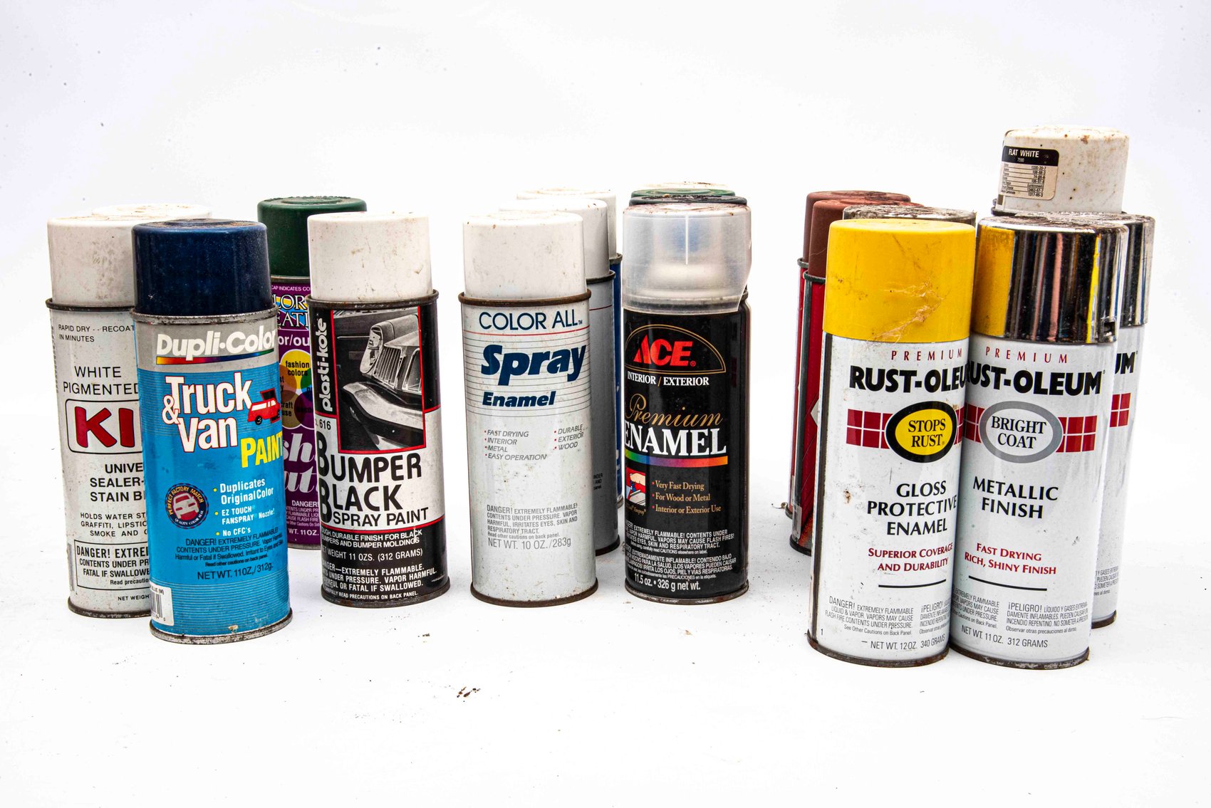 Crate of New and Used cans of spray paint.