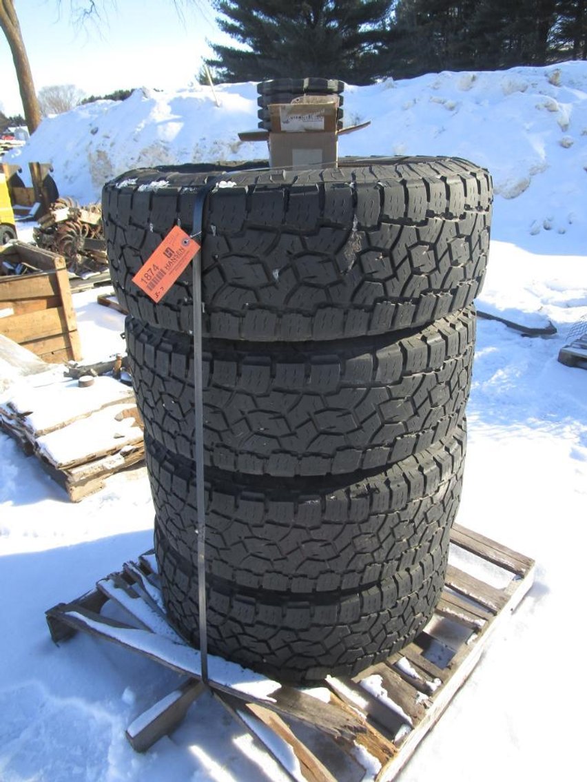 (4) Toyo Tires Open Country A/T LT295/65R20 Tires on 8 Bolt Fuel Rims with Caps and Lugs