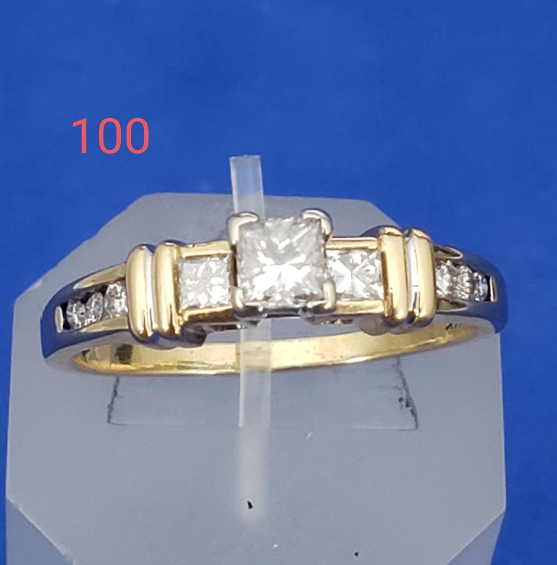 Ladies 14 Karat Yellow Gold Diamond Ring With A Princess Cut Diamond In The Center And Round And Princess Cut Accent Diamonds In The Band. Total Diamond Weight: 0.75 Carats. Color: H/I Clarity: Si2/3 Retail Price: $1950.00