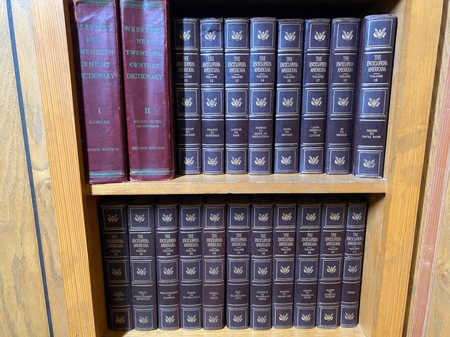 Image for Contents of (2) Shelves Including Vintage Partial Set of Encyclopedia Americana Encyclopedia's and (2) Webster Dictionaries