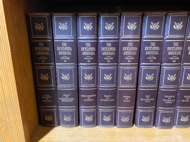 Image for Contents of (2) Shelves Including Vintage Partial Set of Encyclopedia Americana Encyclopedia's and (2) Webster Dictionaries