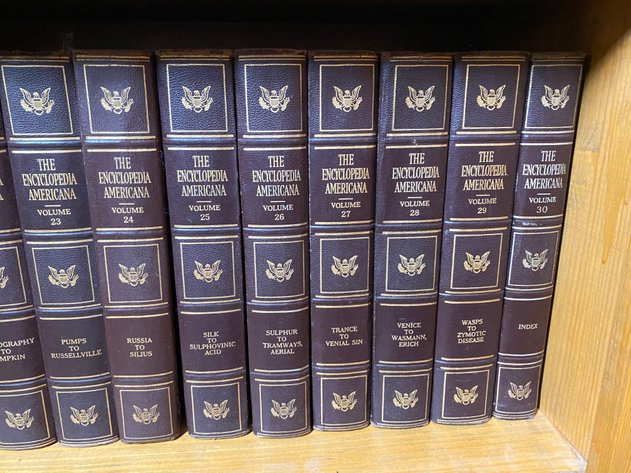 Image for Contents of (2) Shelves Including Vintage Partial Set of Encyclopedia Americana Encyclopedia's and (2) Webster Dictionaries