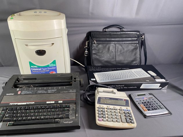 Image for Office Supply Lot, including Royal Paper Shredder, Brother Electronic Typewriter, and I-Home Wireless Keyboard and Mouse for Mac Computer, Briefcase, and Calculators