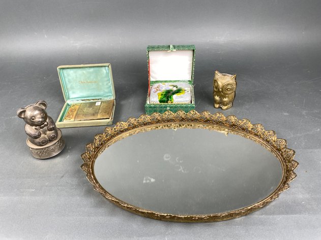 Image for (5) Piece Assortment of Vintage Decor Including MCM Brass Vanity Mirror, Brass Owl Figurine, Bear Bank/Music Box, Elgin American Cigarette Case/Lighter and Floral Cloissoine Trinket Box