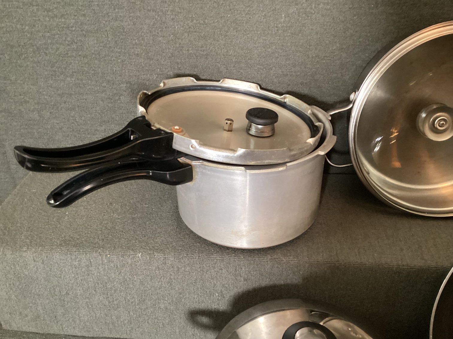Image for Assorted pots and pans, including a pressure cooker
