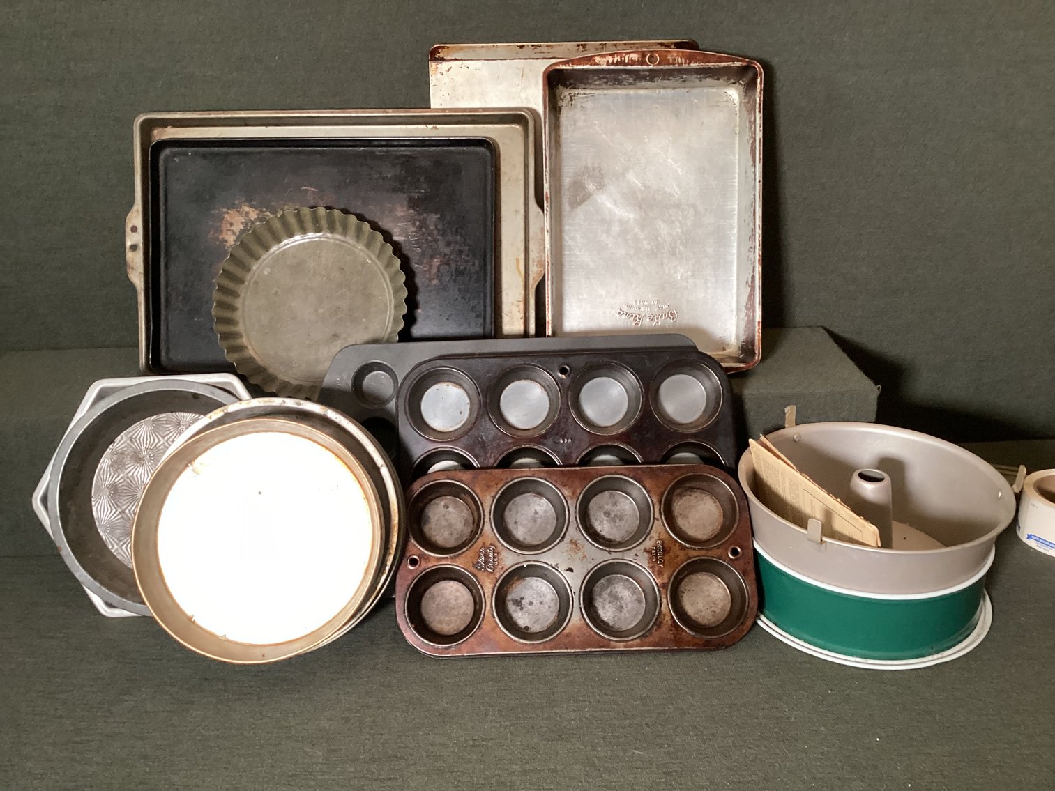 Image for Assorted baking tins, one muffin tin is Wilton