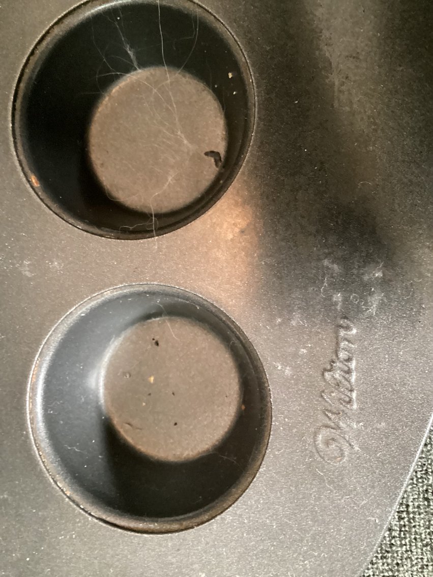 Image for Assorted baking tins, one muffin tin is Wilton