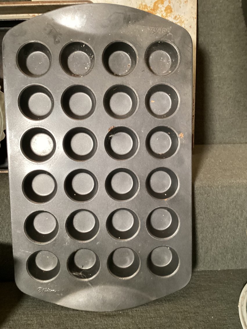 Image for Assorted baking tins, one muffin tin is Wilton