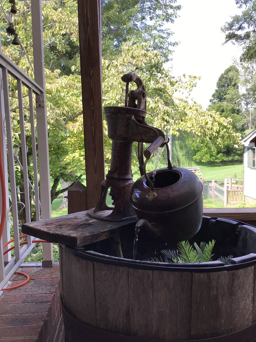 Image for Fountain made from half wine barrel and hand pump