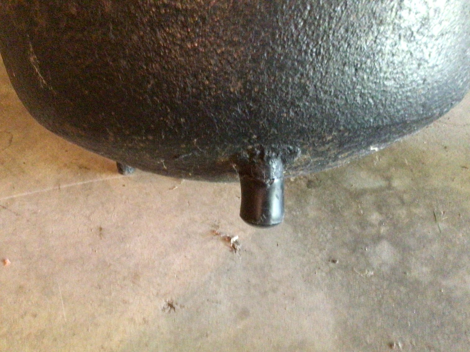 Image for Cast iron kettle and tongs.