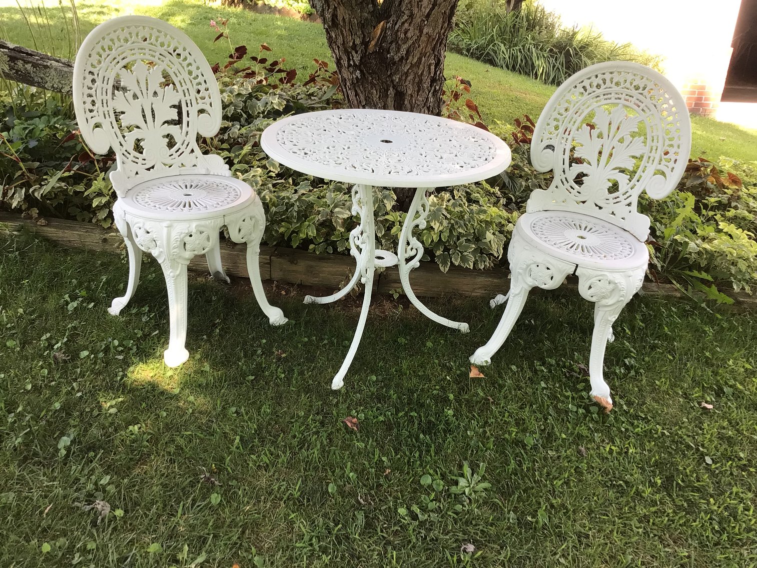 Image for Wrought iron table and two chairs,