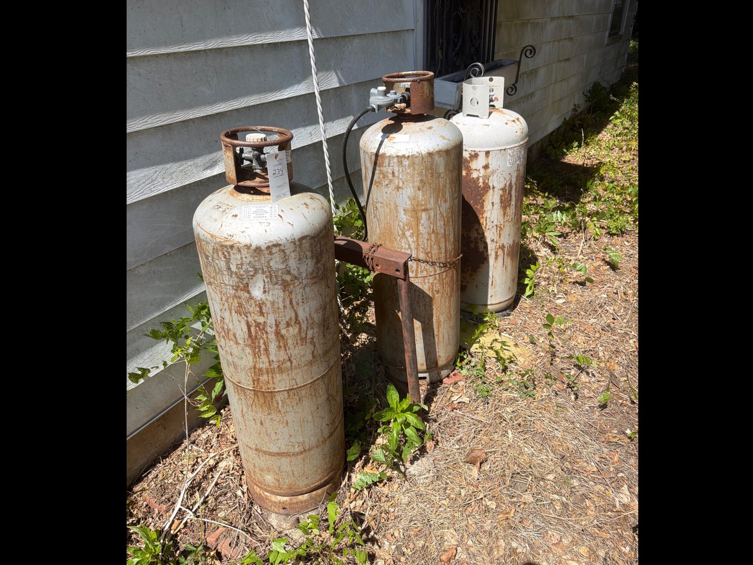 Image for Three propane tanks may have propane in them