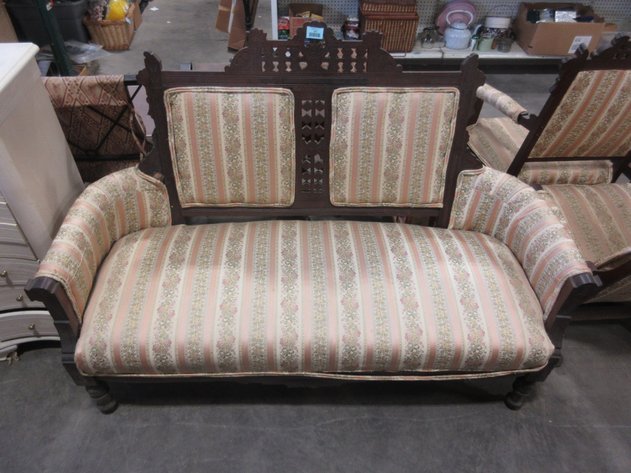 Image for Vintage wooden loveseat with ornate carvings and upholstery
