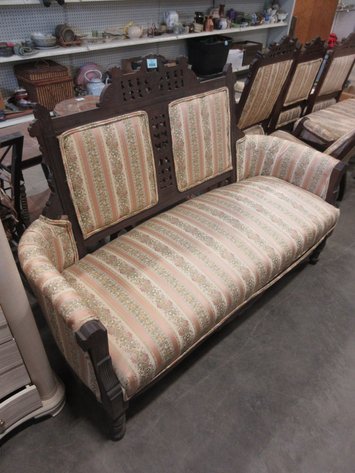 Image for Vintage wooden loveseat with ornate carvings and upholstery