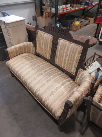 Image for Vintage wooden loveseat with ornate carvings and upholstery