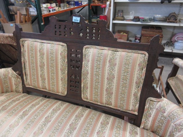 Image for Vintage wooden loveseat with ornate carvings and upholstery