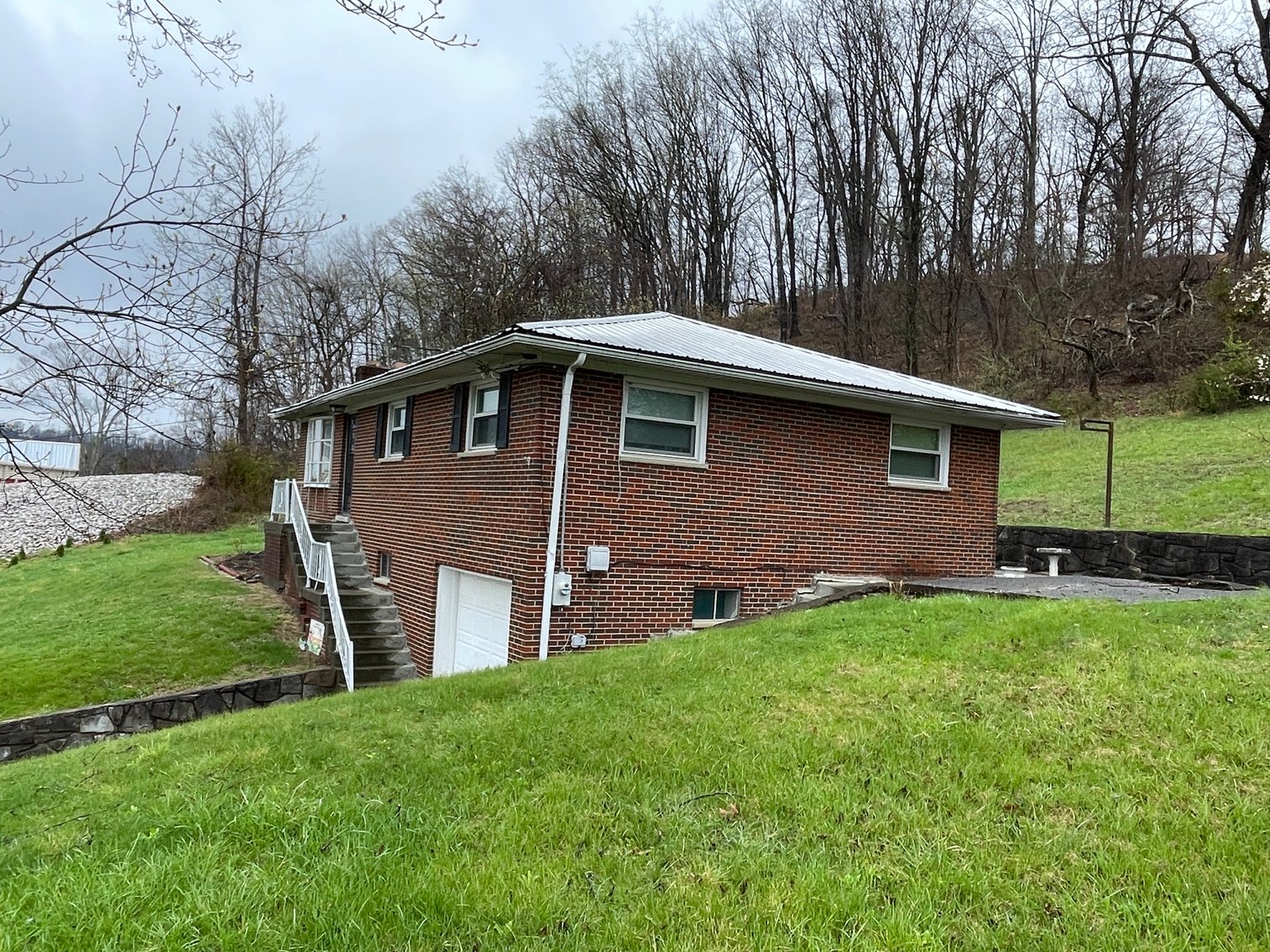 Image for SOLD $107,360 - Income Generating Brick 3 Bedroom on 1.8 Acres in the South Hills of Charleston
