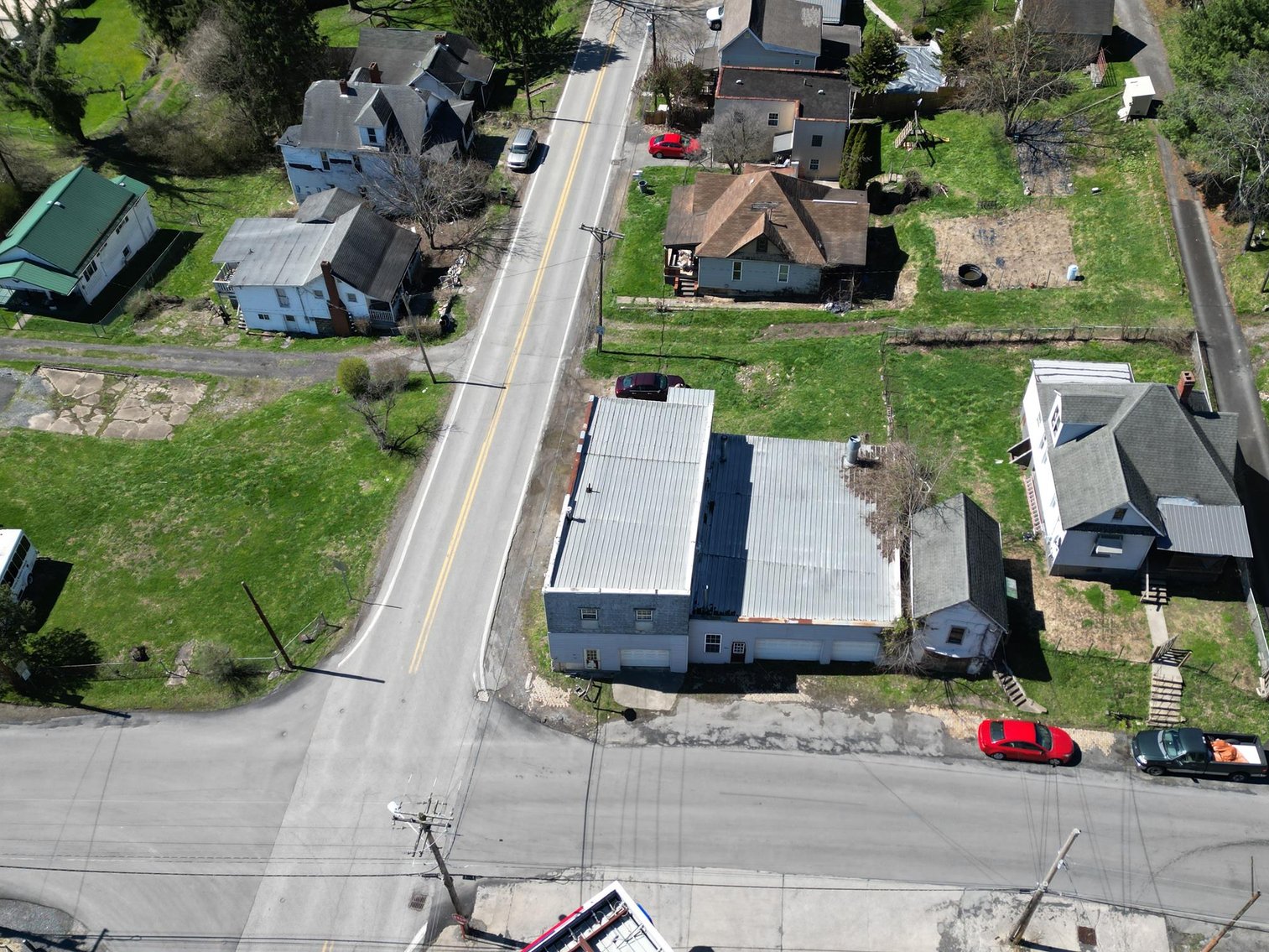 Image for SOLD $63,800 - Commercial Building with Garage Bays & Apartment Selling to the Highest Bidder