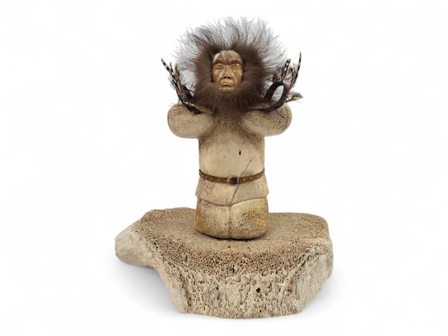 An Elaborate Carved Bone Figure Depicting Alaska Native Dancer