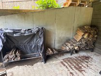 Two Tubular Steel Firewood Racks And Wood
