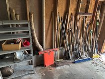 Assorted Garden Tools And Metal Shelving